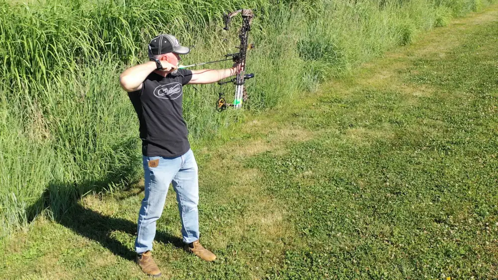 Bowhunter practicing shooting before deer season